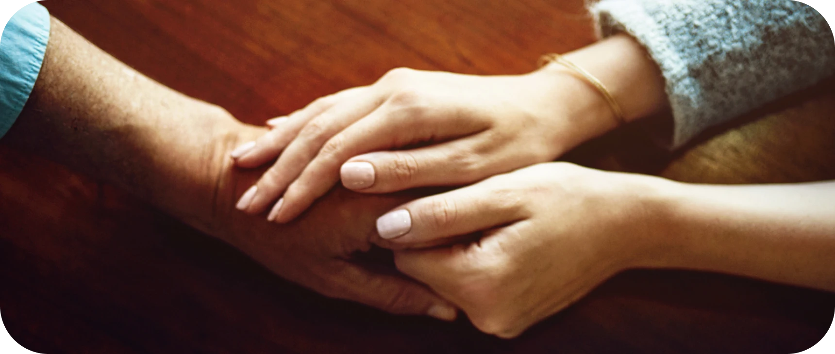Hands offering comfort and support